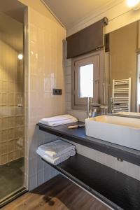 a bathroom with a tub and a sink and a shower at Bungalows Stel-Puigcerdà in Puigcerdà