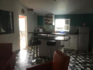 Una cocina o zona de cocina en Résidence MATHO - NONNi