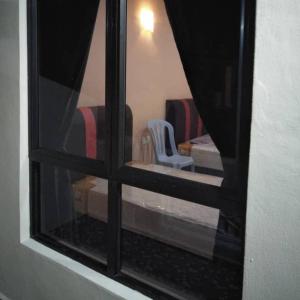 Postel nebo postele na pokoji v ubytování Mutiara Chalet