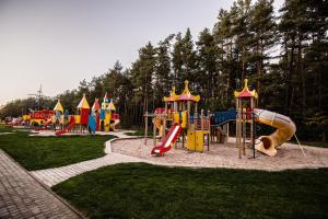 a park with a playground with a slide at Gintarinė KOPA in Palanga