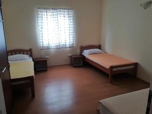 Postel nebo postele na pokoji v ubytování Apartman Rosanda