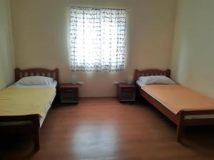 Postel nebo postele na pokoji v ubytování Apartman Rosanda
