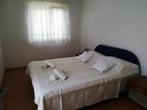 Postel nebo postele na pokoji v ubytování Apartman Rosanda