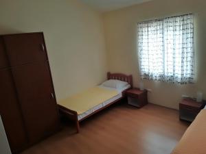 Postel nebo postele na pokoji v ubytování Apartman Rosanda