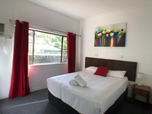 Postel nebo postele na pokoji v ubytování Allan Cunningham Motel