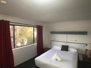 Postel nebo postele na pokoji v ubytování Allan Cunningham Motel