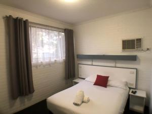 Postel nebo postele na pokoji v ubytování Allan Cunningham Motel