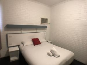 Postel nebo postele na pokoji v ubytování Allan Cunningham Motel