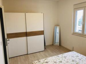 Postel nebo postele na pokoji v ubytování Apartman Petar
