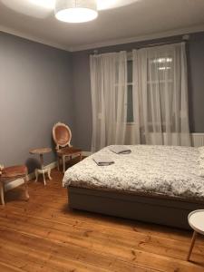 Ein Bett oder Betten in einem Zimmer der Unterkunft Eleven apartment