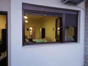 a window with a view of a room at John's Apartments in Nea Michaniona
