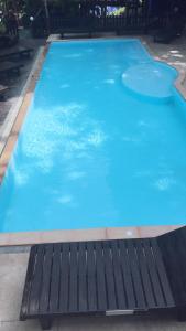 a large blue swimming pool with two frisbees in it at JJ Bungalow in Phi Phi Islands