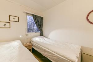 Postel nebo postele na pokoji v ubytování Garður guesthouse