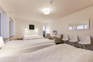 Postel nebo postele na pokoji v ubytování Garður guesthouse