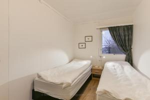 Postel nebo postele na pokoji v ubytování Garður guesthouse