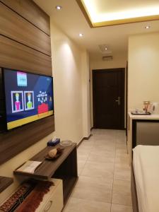 TV o dispositivi per l'intrattenimento presso Seven Days Hotel