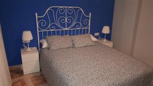 A bed or beds in a room at Apartamento La Muralla de Teruel