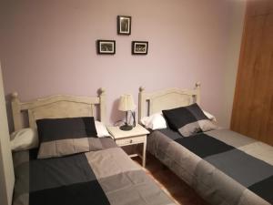 A bed or beds in a room at Apartamento La Muralla de Teruel
