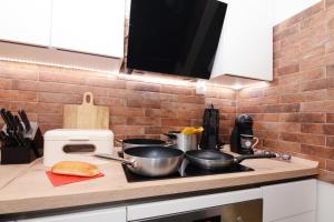 Kuchyňa alebo kuchynka v ubytovaní XY Suites - Design Apartments