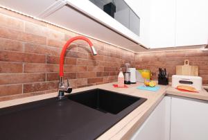 Kuchyňa alebo kuchynka v ubytovaní XY Suites - Design Apartments