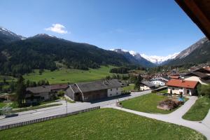 a view of a village with mountains in the background at Klauserhof in Trins