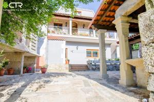 a villa with a swimming pool and a house at NATURAL ENVIRONMENT AND BEACHES-CTR in Valmaior