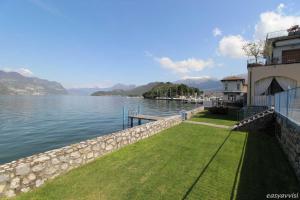 a house on the shore of a body of water at IN SUITE LAKE 1 in Iseo