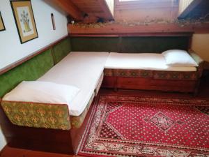 Кровать или кровати в номере Appartamento Piancavallo