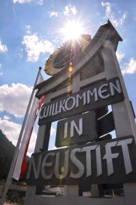 a sign for a sign for a new institution at Hotel Burgstall in Neustift im Stubaital