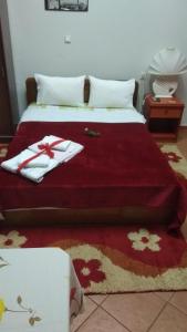 Postel nebo postele na pokoji v ubytování Guest House Sakis.