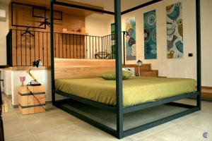 Postel nebo postele na pokoji v ubytování Punta Bianca Suite & Home Experience