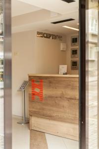 a view of the reception desk of a hyper light store at Hugo Hotel in Varna City