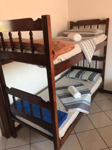 a pair of bunk beds in a room at Pousada Mera in Florianópolis