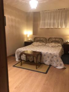 Ένα ή περισσότερα κρεβάτια σε δωμάτιο στο Apartamento con jardin