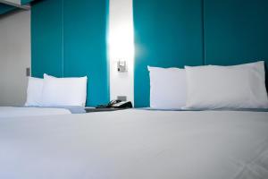 Postel nebo postele na pokoji v ubytování Tilbury Inn