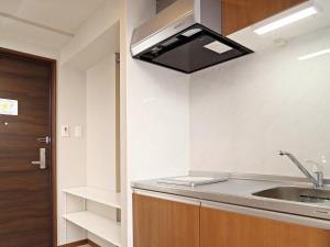 Kuchyň nebo kuchyňský kout v ubytování Smart Condo Tomari + 26 fotografií