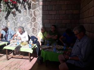 a group of people sitting around a table at Selam Guest House in Lalibela