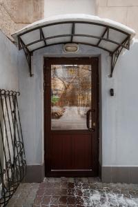 a door to a building with snow on top of it at Hotel Sverdlova 27 in Yekaterinburg