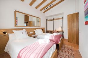 Giường trong phòng chung tại La Piconera (Petit Luxe)
