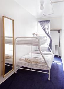 a room with two bunk beds and a mirror at American Dream in New York