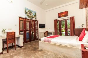 Un pat sau paturi într-o cameră la Gomez Place +101 fotografii