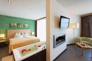 Postel nebo postele na pokoji v ubytování Hotel Amaten
