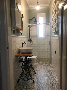 a bathroom with a sink and a toilet at Apartament Odrzanka in Gryfino