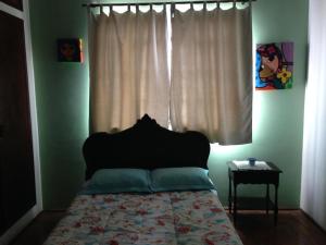 A bed or beds in a room at casa com piscina no centro da cidade