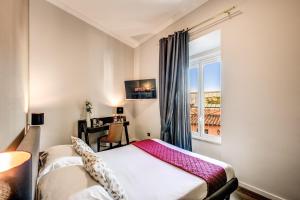Posteľ alebo postele v izbe v ubytovaní Piccola Navona Roof Garden