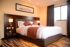 Avari Xpress Gulberg客房内的一张或多张床位
