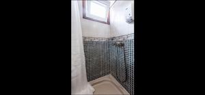 a bathroom with a shower with a window at Casa Cora Con Jacuzzi in Breña Baja +27 photos