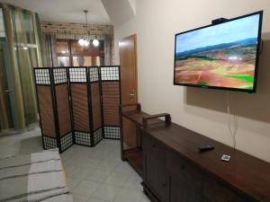 a living room with a flat screen tv on the wall at Apartmán Holandská 120 Beroun in Beroun