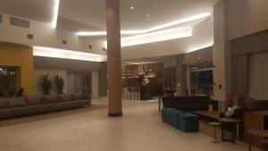 a large living room with couches and a table in a building at Apartamento no Olimpia Park Resort in Olímpia