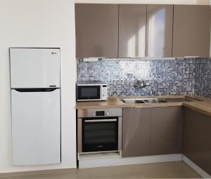 Kuchyň nebo kuchyňský kout v ubytování Appartements Lamblin